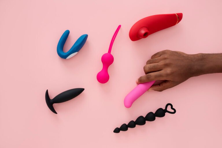 Sex toys and a person's hand