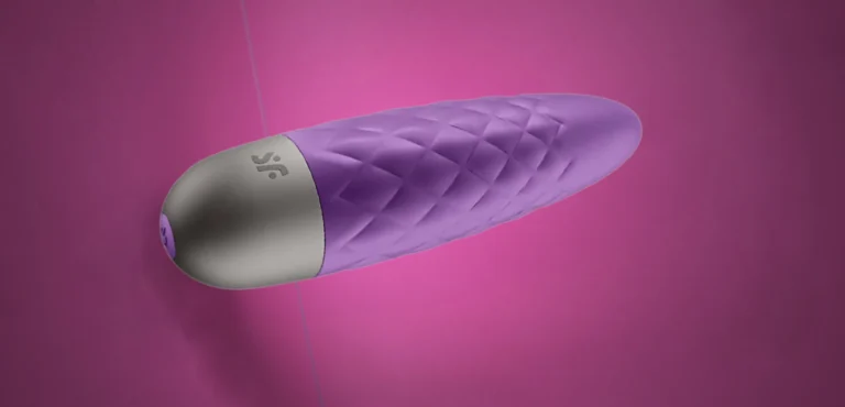 Mini Vibrator on a Purple Background