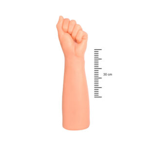 Plastic mannequin forearm with a clenched fist beside a vertical 30 cm measurement scale