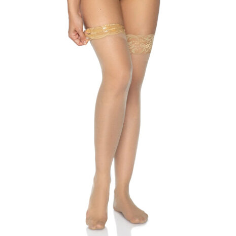 1022nudex2jpg Woman's legs in beige lace-top thigh-high stockings against a white background.