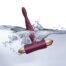 Pink vibrator partially submerged in water with splashing bubbles, suggesting bath-time use.