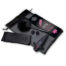 Sex toy kit on a gray bag: black dildo with pink ring, a wand vibrator with a furry sleeve, blindfold, and small accessories on a padded surface.