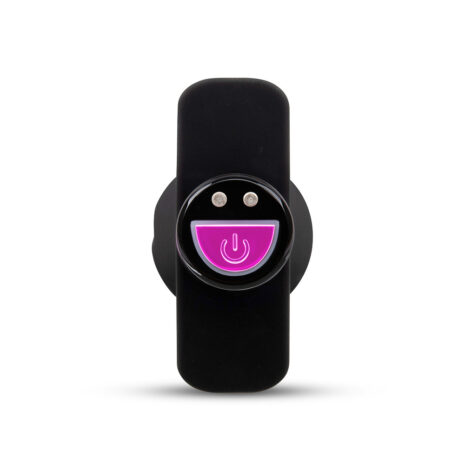 22128x2jpg Close-up of a black electronic device with a circular pink illuminated power button in the center, on/off switch prominent.