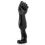 Black glossy sculpture of a standing leg with a clenched fist at the knee, mounted on a round base.