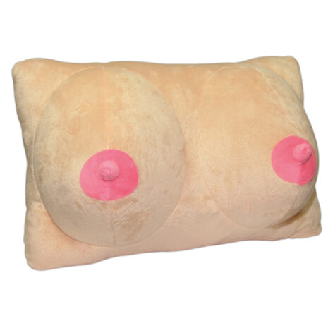 Beige plush pillow shaped like female breasts with pink nipples; a novelty adult-themed cushion.