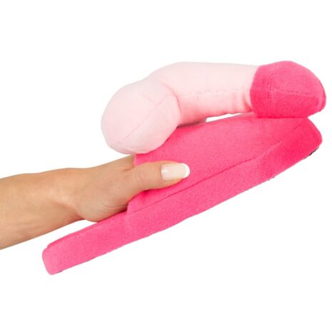779849x2jpg Hand holding a soft pink plush sex toy with a long curved shaft and rounded tip against a white background.
