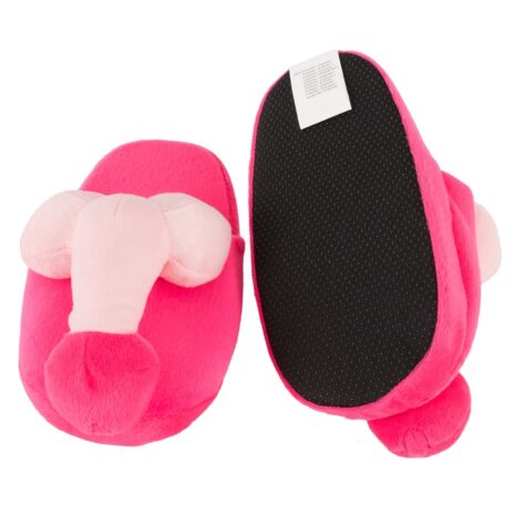 779849x3jpg Pink plush elephant slippers for kids with trunk detail and textured sole on one foot