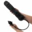 Black silicone dildo with a separate control remote, held by hands against a white background (adult sex toy).