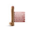 Beige dildo with a suction base and six pink feature banners listing: soft realistic feel; strong suction cup base; harness compatible; lab‑tested body safe; fragrance & parabens free; latex & phthalate free.