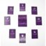Purple Domino card game spread on white surface with a central stack and a die on top; cards show logos and icons.