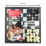 Sex Chess game set on a chessboard with a red instruction booklet titled 'SEX CHESS', timer, and cream-colored game pieces on the right.