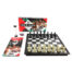 Erotic-themed chess set with black and white pieces, branded box reading 'Sex-O-Chess' and accompanying manual and timer on a white background.