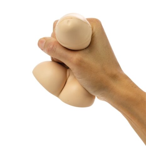 Hand tightly gripping three beige eggs against a white background
