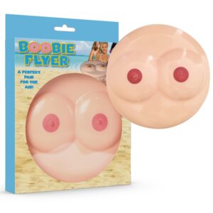 Packaging for a novelty beach toy showing two large breast-shaped inflatables labeled 'Boobie Flyer' with a beach background.