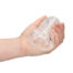 Clear textured sex toy held in a hand, showing internal ridges.