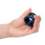 Hand holding a dark blue silicone ring-shaped object between fingers, close-up.