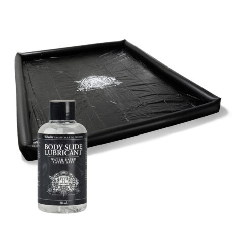 N7979x2jpg Bottle labeled 'Body Slide Lubricant' in front of a black rectangular tray, product shot style.