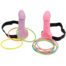 Two pink silicone dildos with black strap harnesses, surrounded by colorful rubber bracelets.