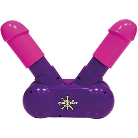 Dual-ended pink twin shaft sex toy attached to a purple base labeled Cum Face (adult product)
