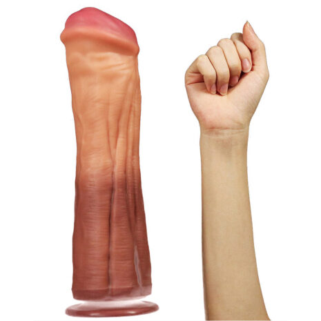 R4526x3jpg Life-size pink dildo standing upright beside a clenched fist for scale.