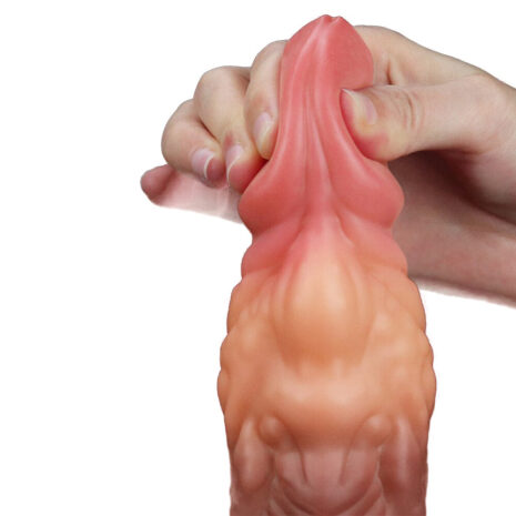 R4527x2jpg Hand gripping a pink silicone dildo, showing its flexible texture and veins.