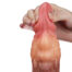 Hand gripping a pink silicone dildo, showing its flexible texture and veins.
