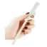 Hand holding a pale translucent phallic sex toy with a textured grip at the end