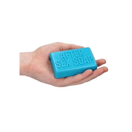 SLI182x2jpg Blue bar of soap engraved with 'AFTER SEX SOAP' being held in a cupped hand.