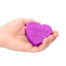 Hand holding a purple heart-shaped bar with the words 'DIRTY LOVE' embossed in the center.