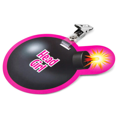 SMGNx3jpg Pink heart-shaped badge with a black center reading 'Head Girl' and a metal clip, featuring a cartoon explosion at the nozzle.