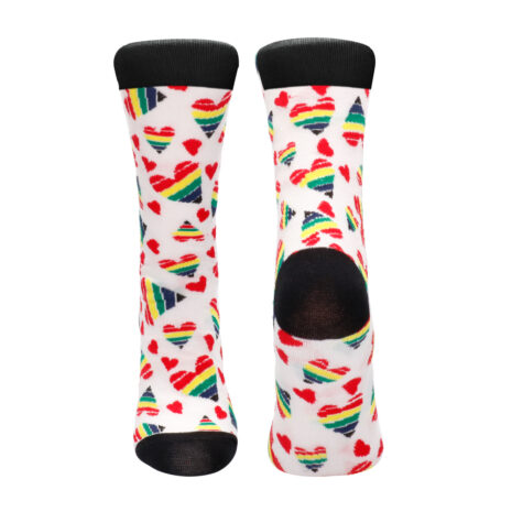 SOCK005-2x2jpg Pair of white knee-high socks with rainbow hearts and striped triangle patterns; black toes and cuffs, one heel has a hole edge showing.