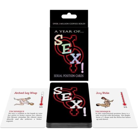 bgc41x1jpg A black card deck titled 'A Year of Sex! Sexual Position Cards' with male/female symbols intertwined on the cover, shown with open cards on a white surface.